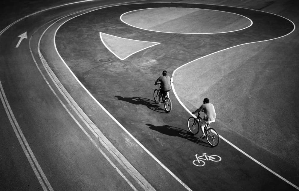 Cyclists on a Question Mark by Marc Apers — canvas wall art