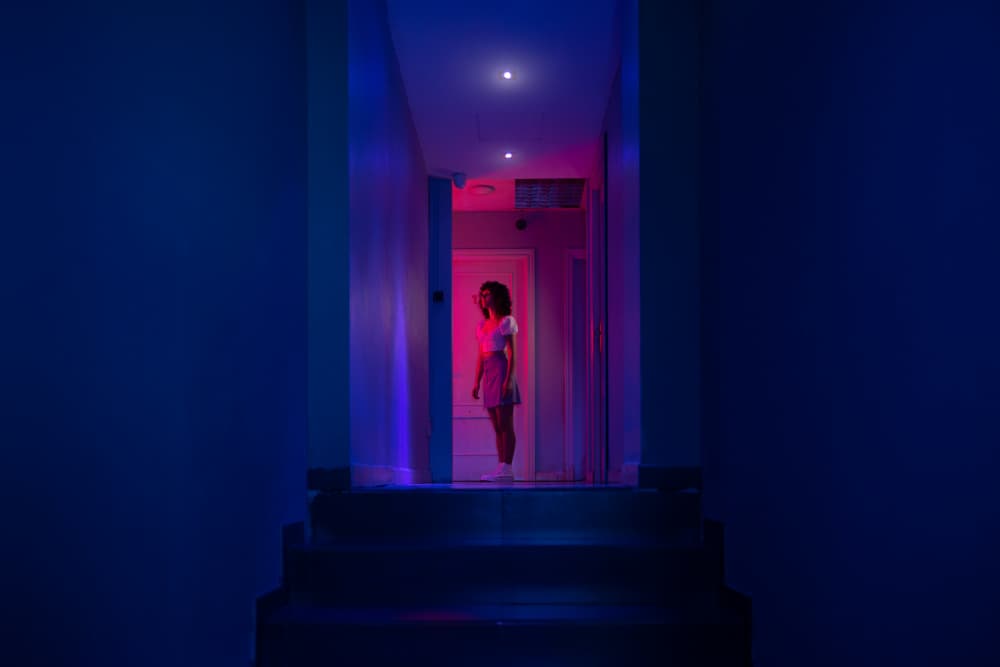 Woman In Neon Hallway by Jesus Gonzalez Vera — canvas wall art