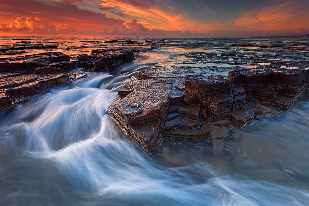 Vibrant Flowing Ocean Sunset by Jingshu Zhu — canvas wall art