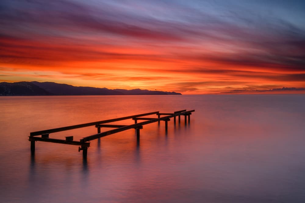 Fiery Sunset Pier by Franco Ameli — canvas wall art