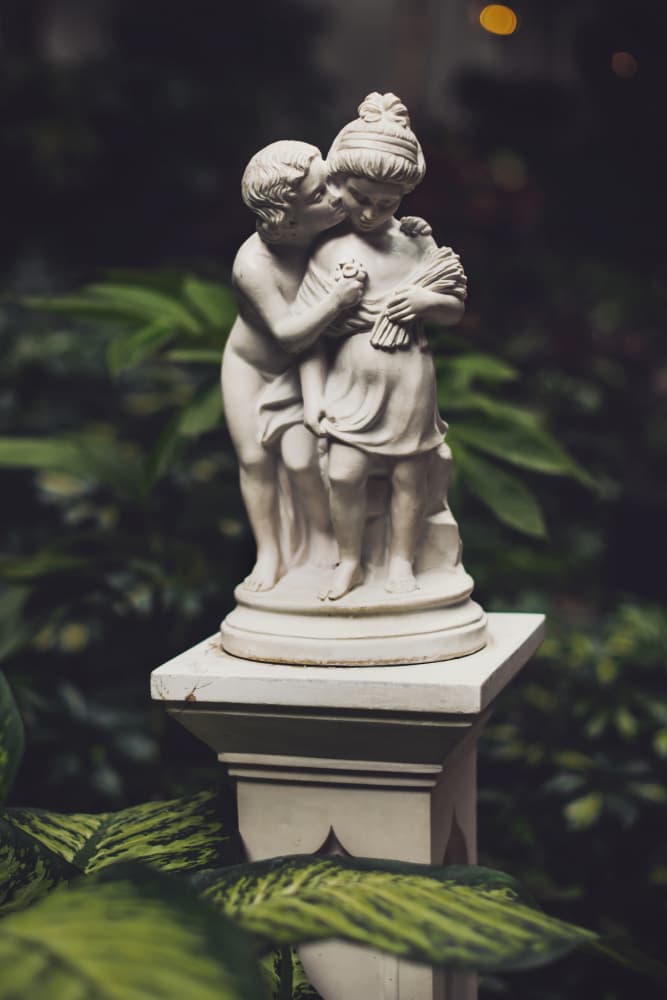 Innocent Kissing Children Statue by Tim Mossholder — canvas wall art