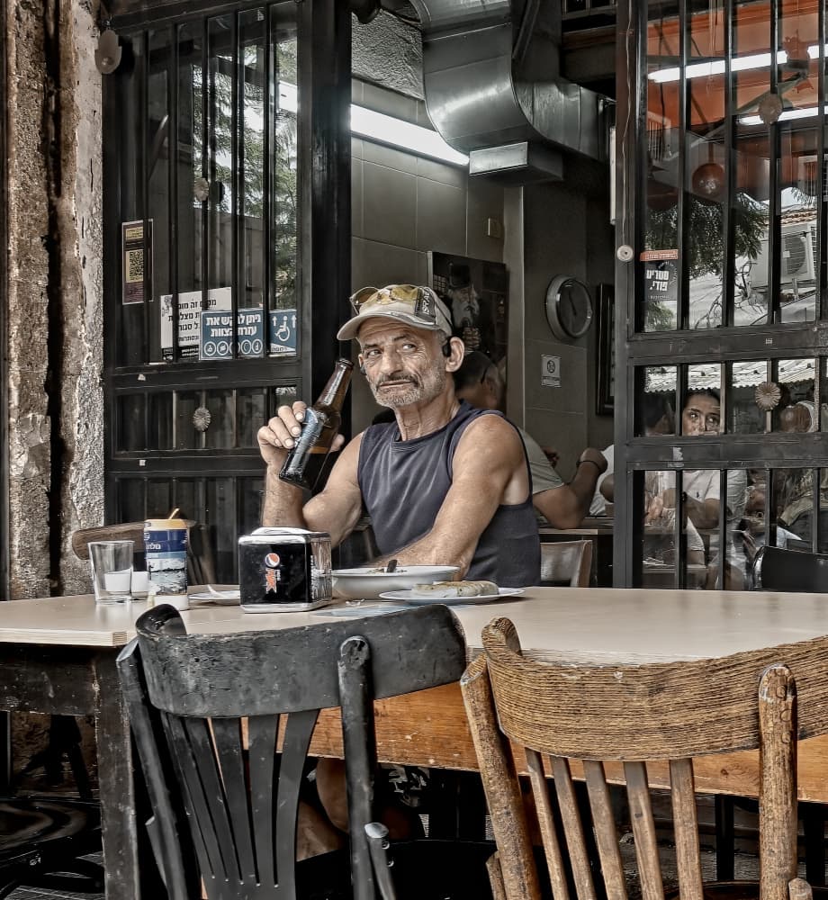 Man at Urban Cafe by zyfeller — canvas wall art