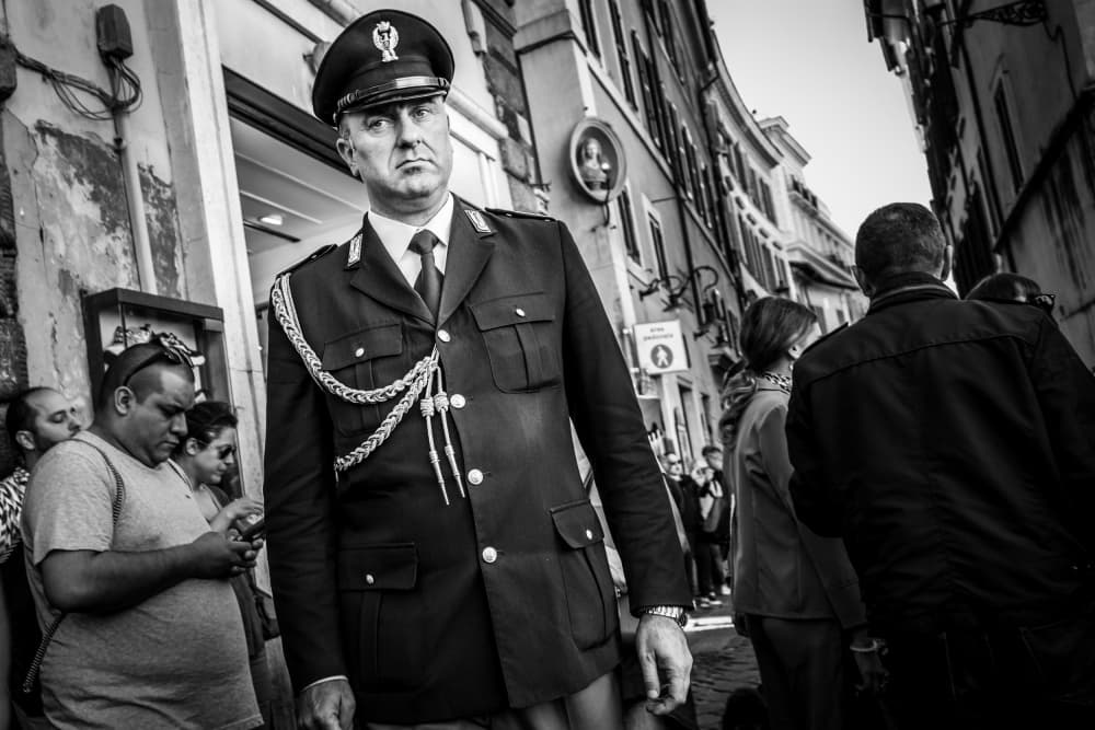 Stern Officer City Street by Rolf Gasser — canvas wall art