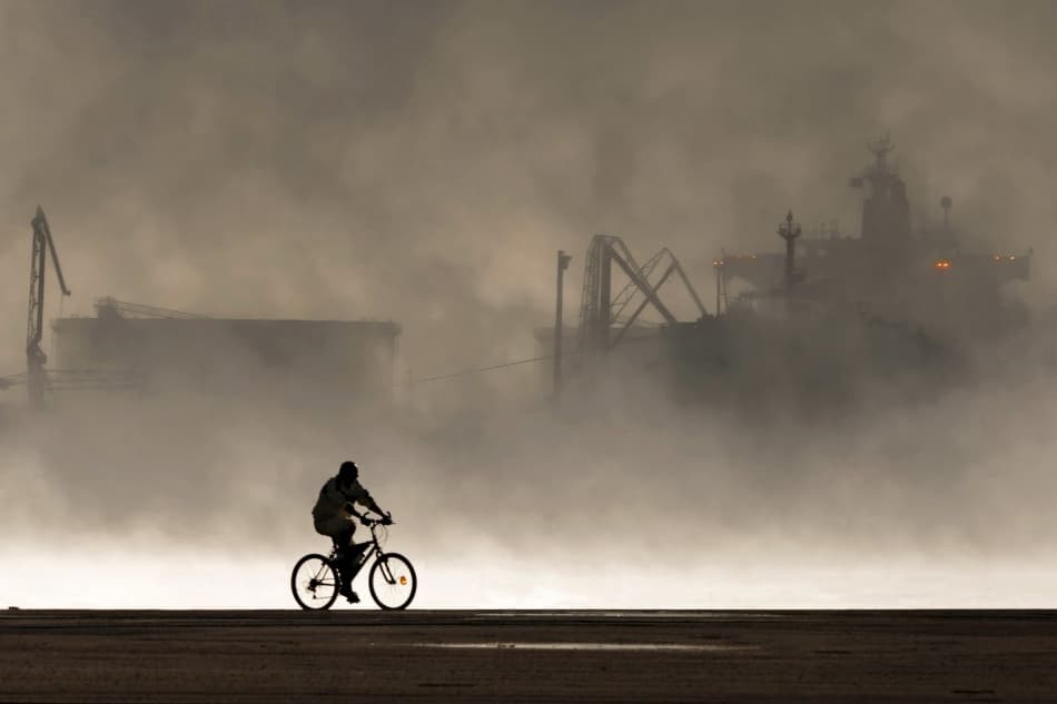 Cyclist In Foggy Port by Michel Guyot — canvas wall art