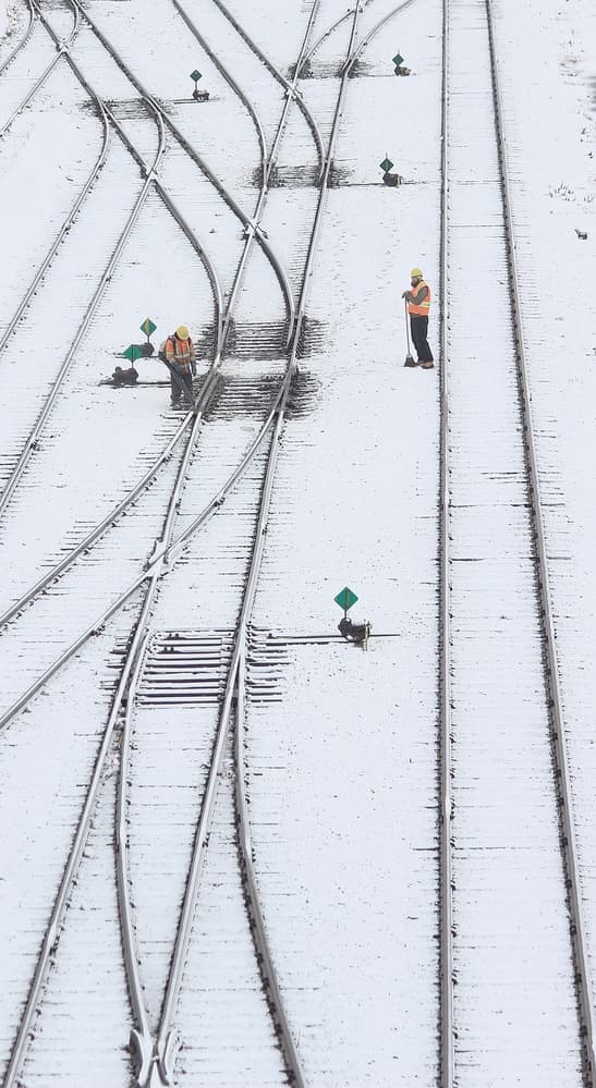 Snowy Railroad Work by Jian Wang — canvas wall art