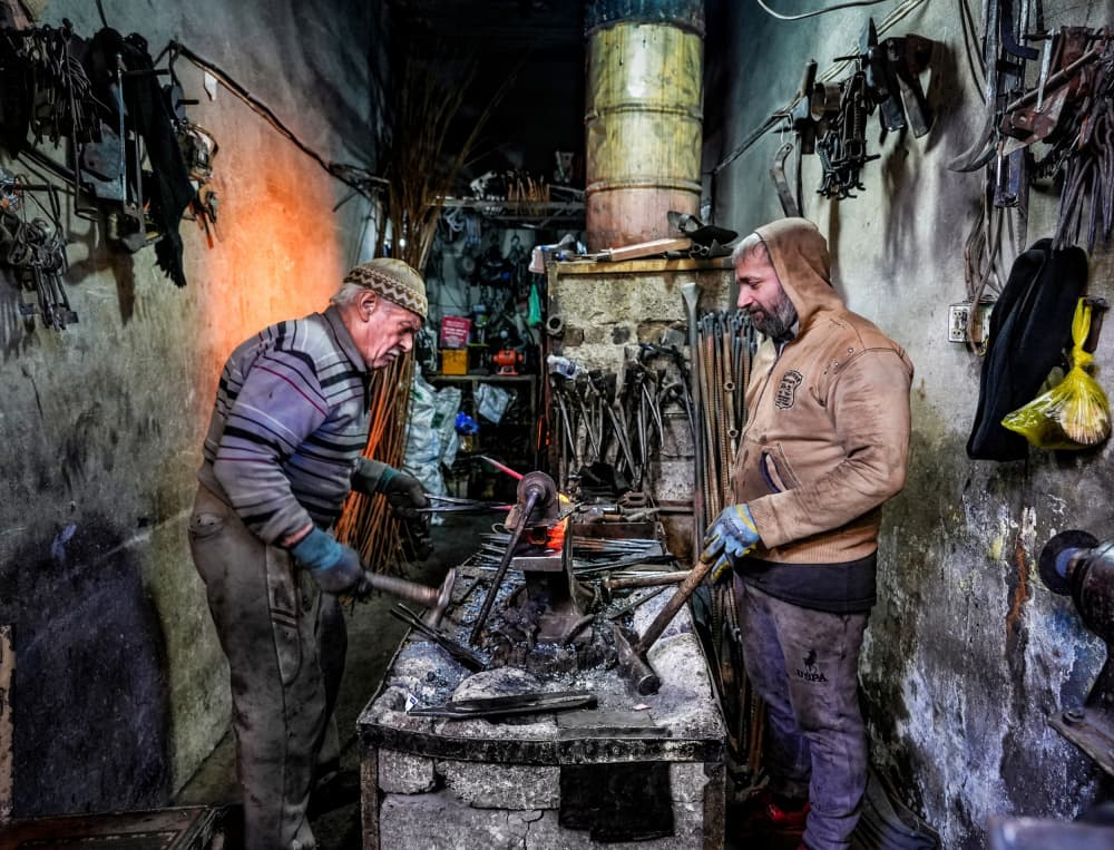 Blacksmiths at the Forge by Bashar Alsofey — canvas wall art