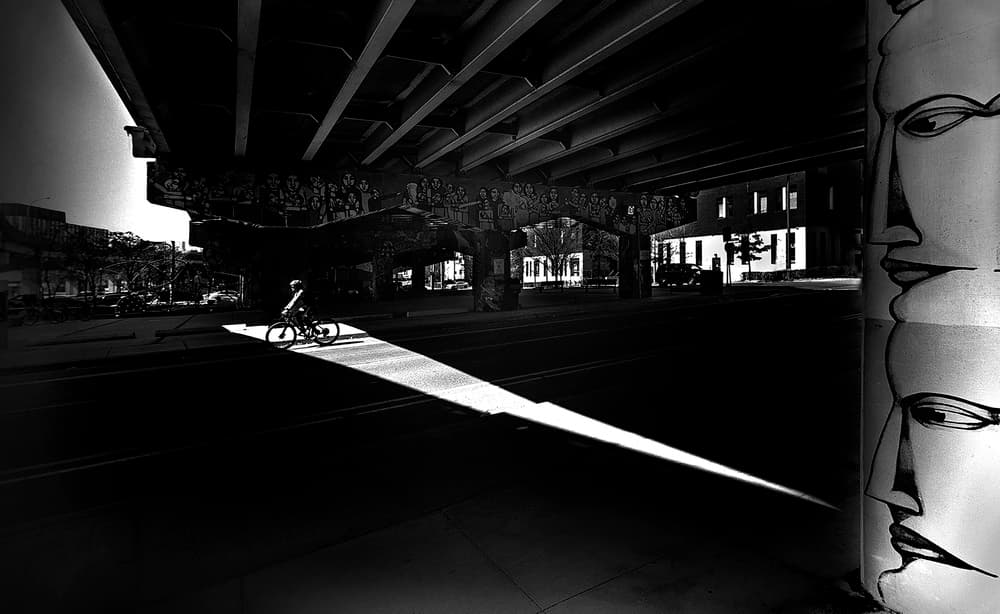 Biker in Dramatic Light by Louie Luo — canvas wall art