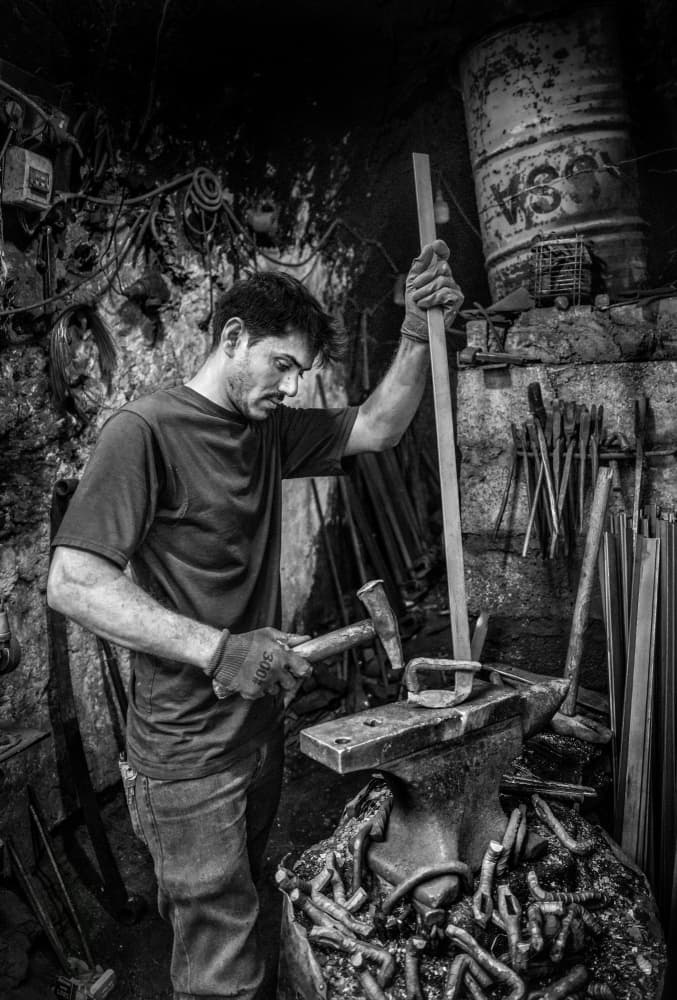 Blacksmith At The Forge by Bashar Alsofey — canvas wall art