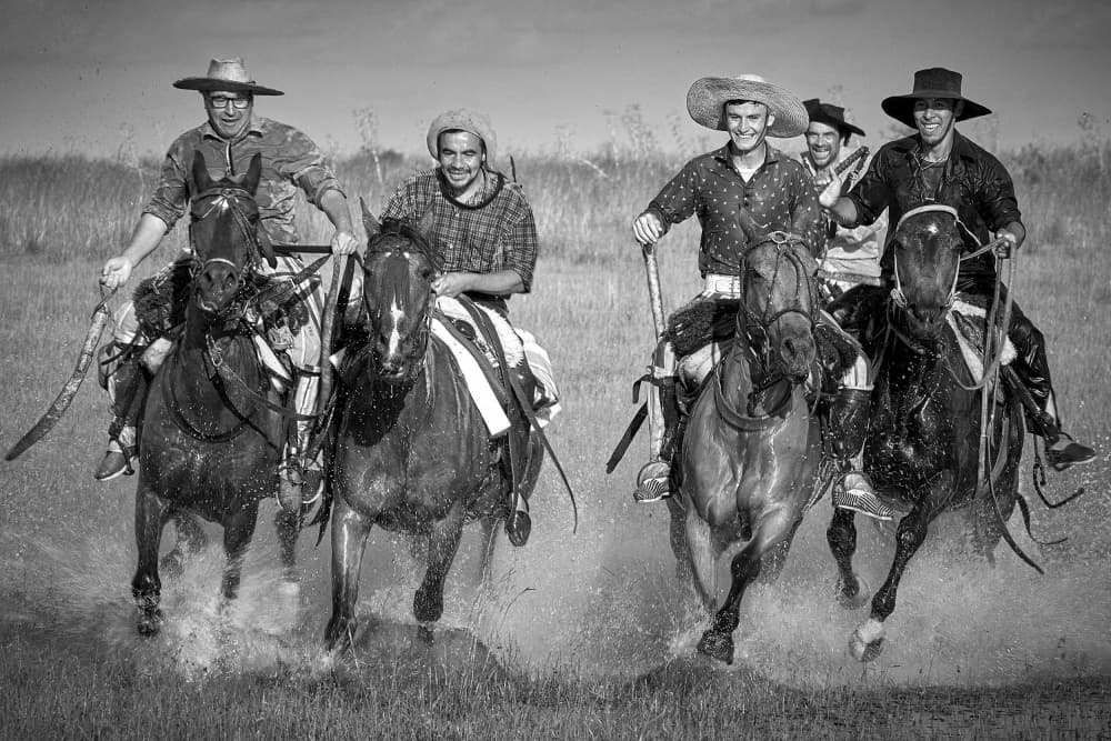 Galloping Horsemen Splash by Birgith Norelli — canvas wall art