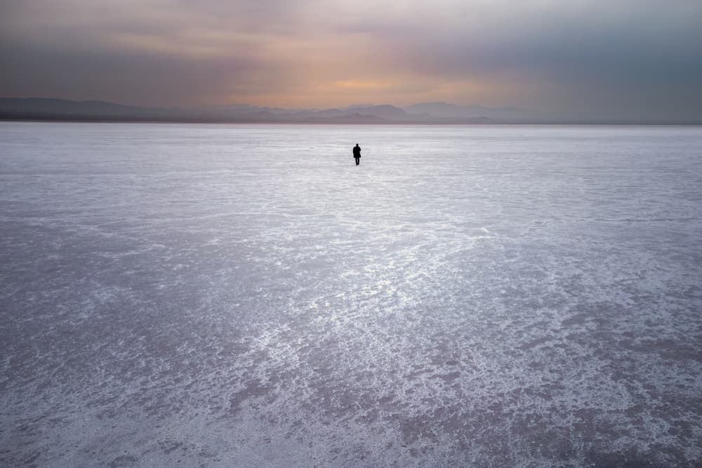 Solitary Figure Salt Flats by Hosein Babaei — canvas wall art