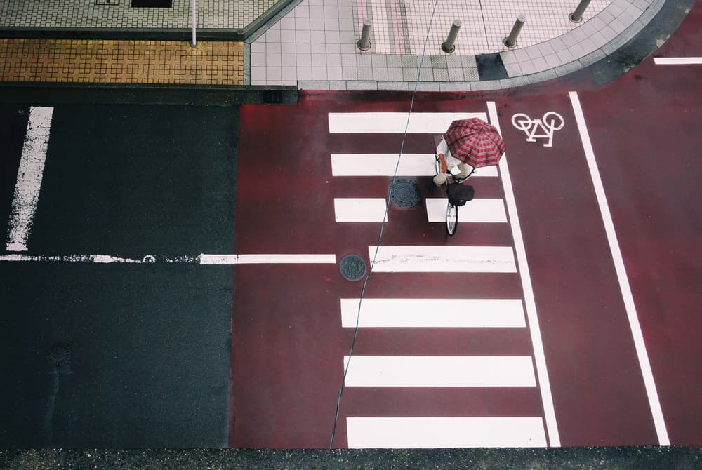 Red Lane Cyclist by Haruyo Sakamoto — canvas wall art