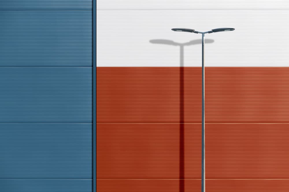 Geometric Wall and Lamp Shadow by Andrea Comari — canvas wall art