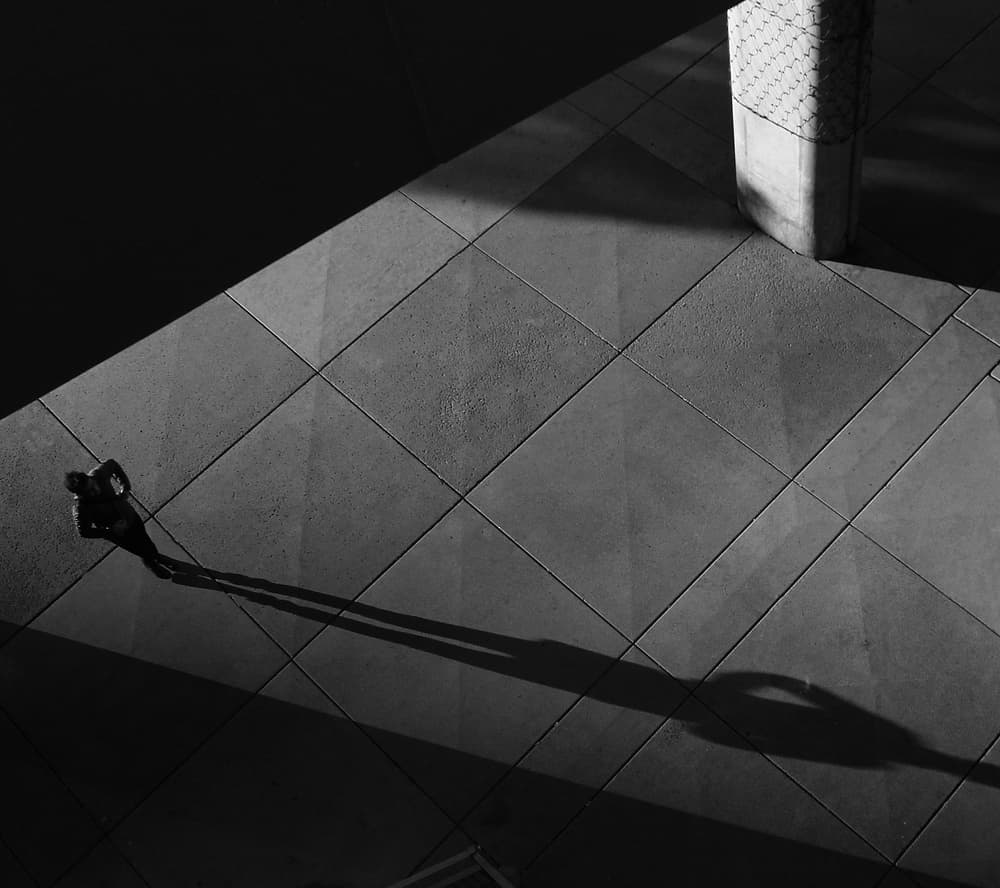 Lone Man Diagonal Shadow by Jian Wang — canvas wall art