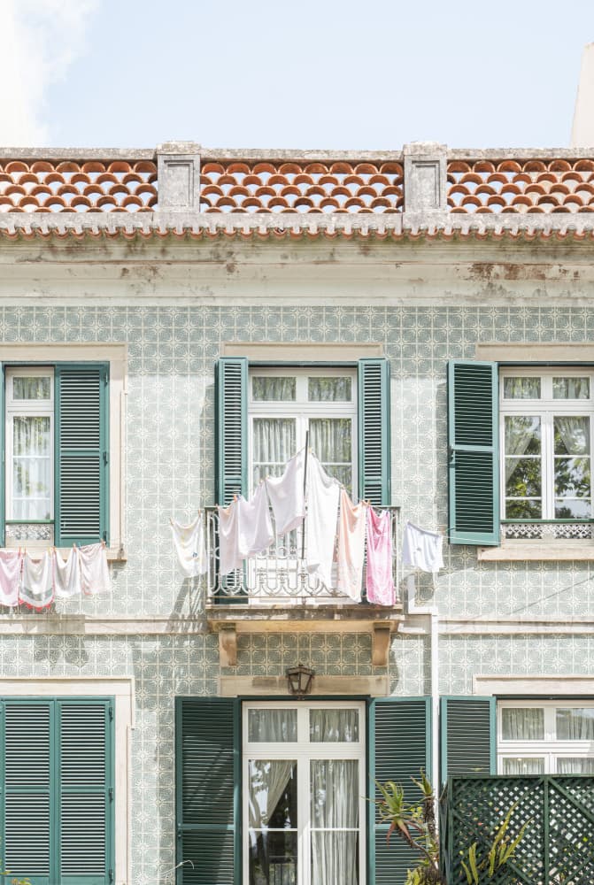 Laundry Day Balcony by Henrike Schenk — canvas wall art