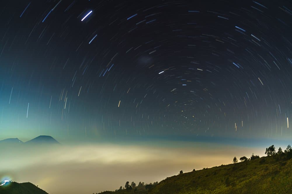Star Trails Over Mountains by Evi Soedarsono — canvas wall art