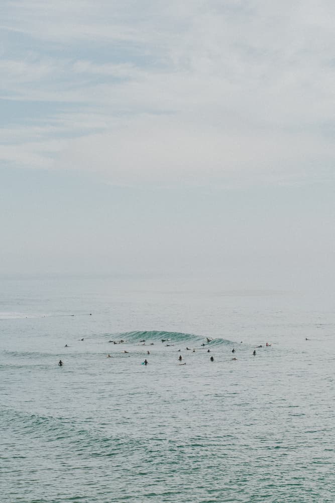 Serene Ocean Surfers by Claudia Casal — canvas wall art