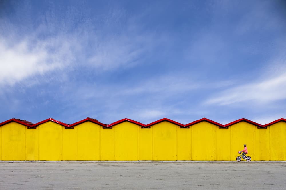 Yellow Wall Bike Ride by Luciano Caturegli — canvas wall art