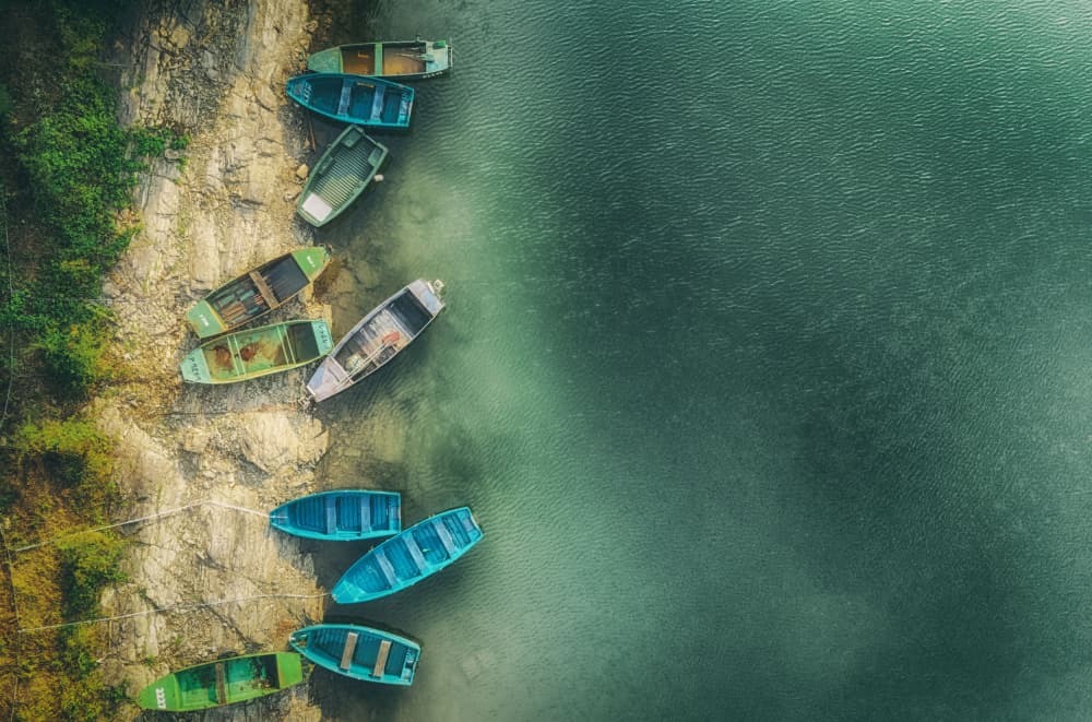 Calm Lake Shore Boats by Guy Krier — canvas wall art