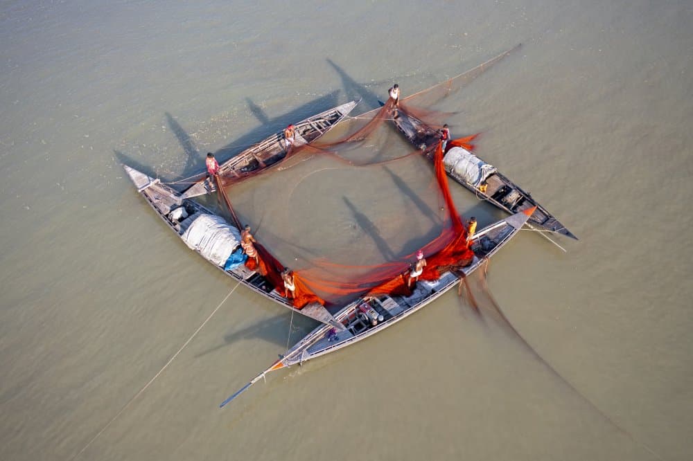 Orange Net Fishing Circle by Azim Khan Ronnie — canvas wall art
