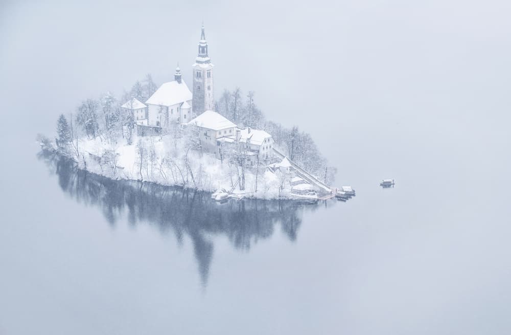 Snowy Island Reflection by Ales Krivec — canvas wall art