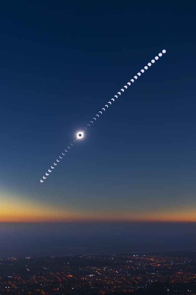 Solar Eclipse City View by Tengyu Cai — canvas wall art