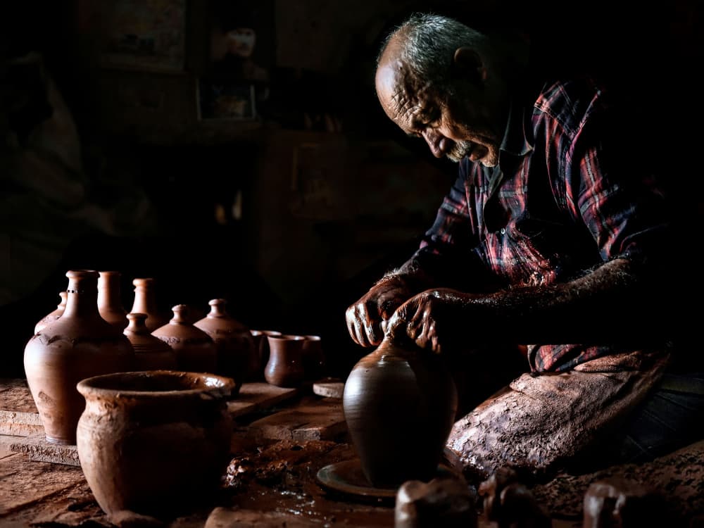 Master Potter At Work by Irene Perovich — canvas wall art