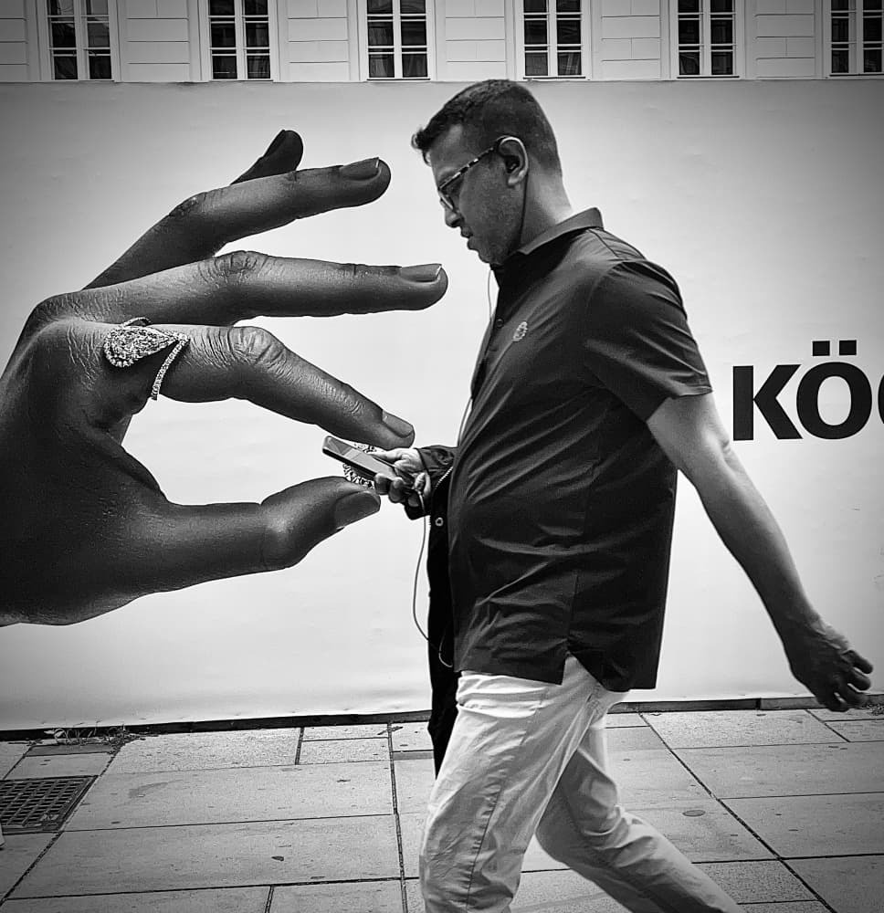 Giant Hand Street Scene by Mirela Momanu — canvas wall art