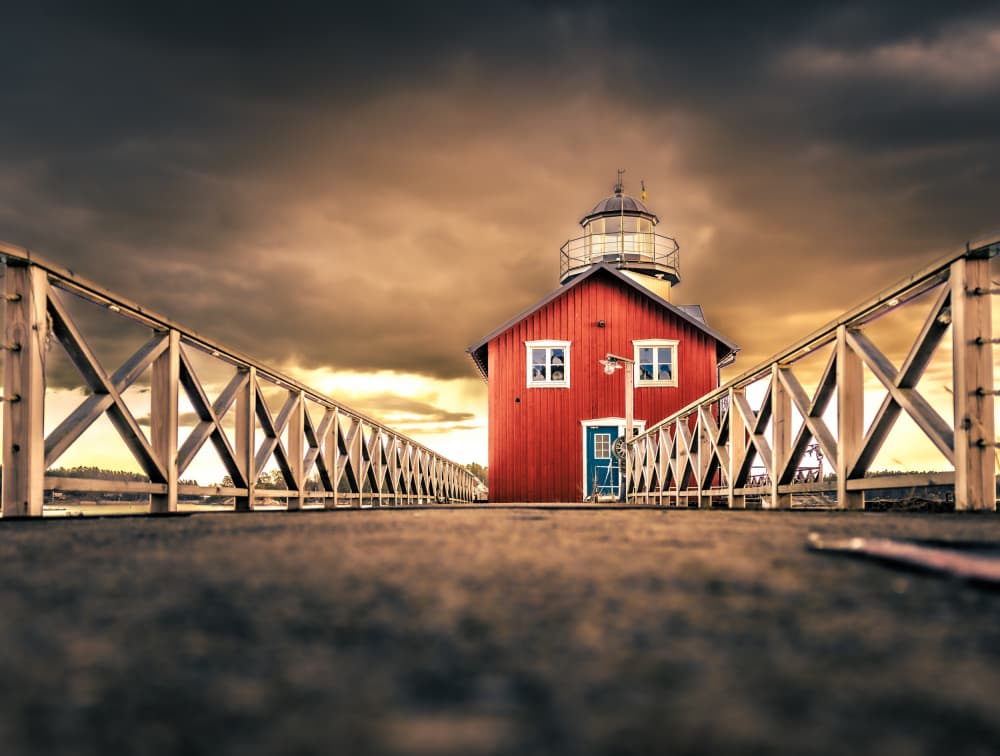Dramatic Lighthouse Pier by Stephanie Kleimann — canvas wall art