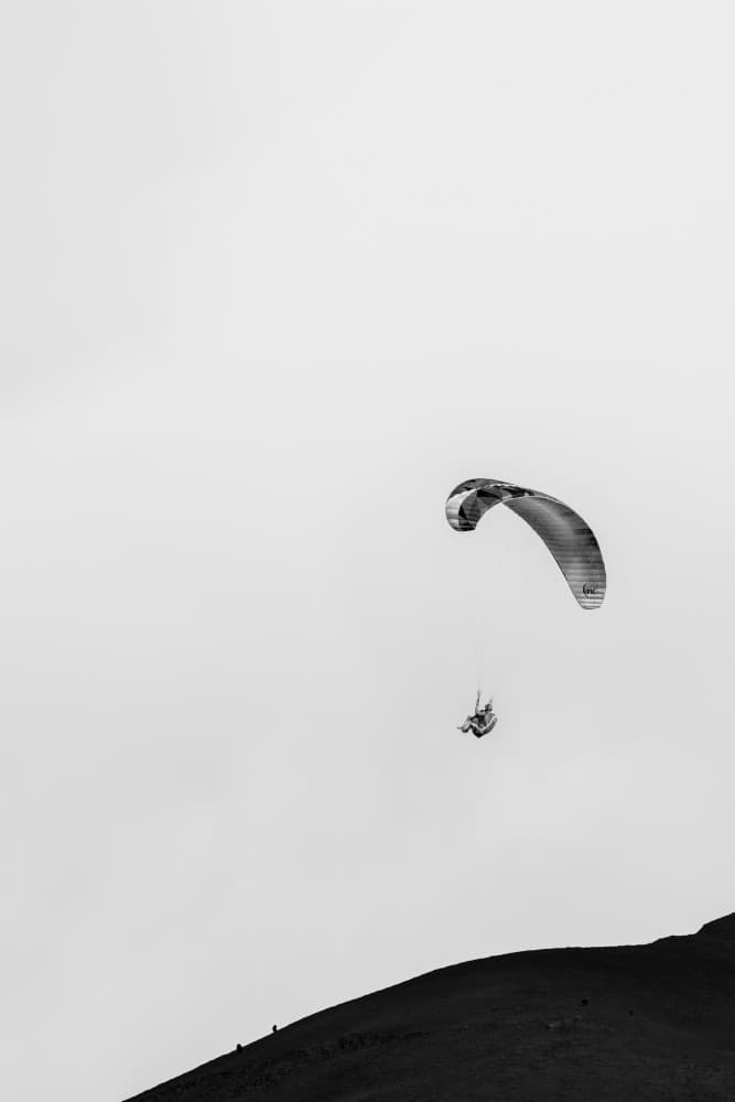 Paraglider Over Mountain by Bill Wang — canvas wall art