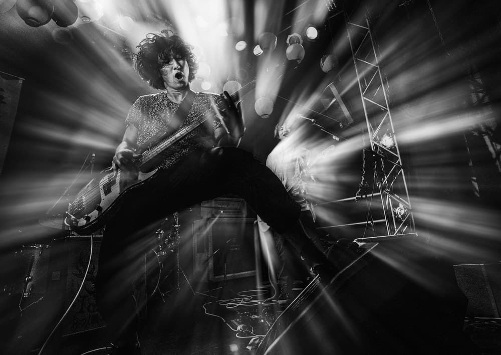 Concert Guitarist Jump by Kenji Nakamatsu — canvas wall art