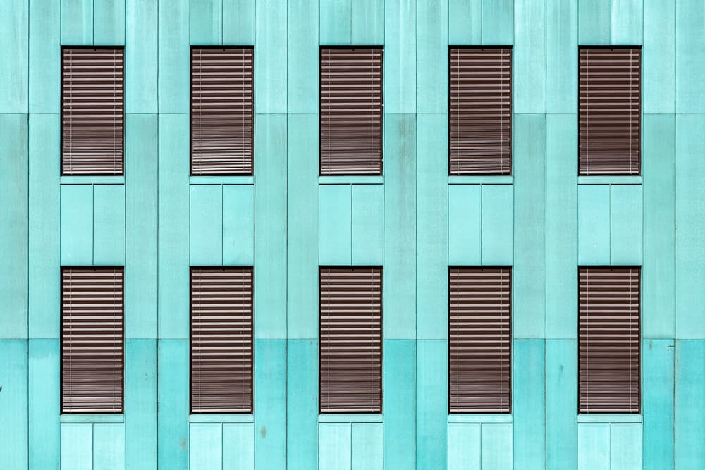 Teal Building Facade by Franco Tessarolo — canvas wall art