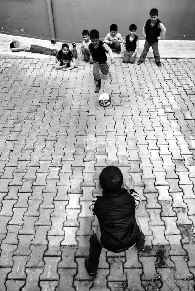 Kids Playing Soccer by Ali Ayer — canvas wall art