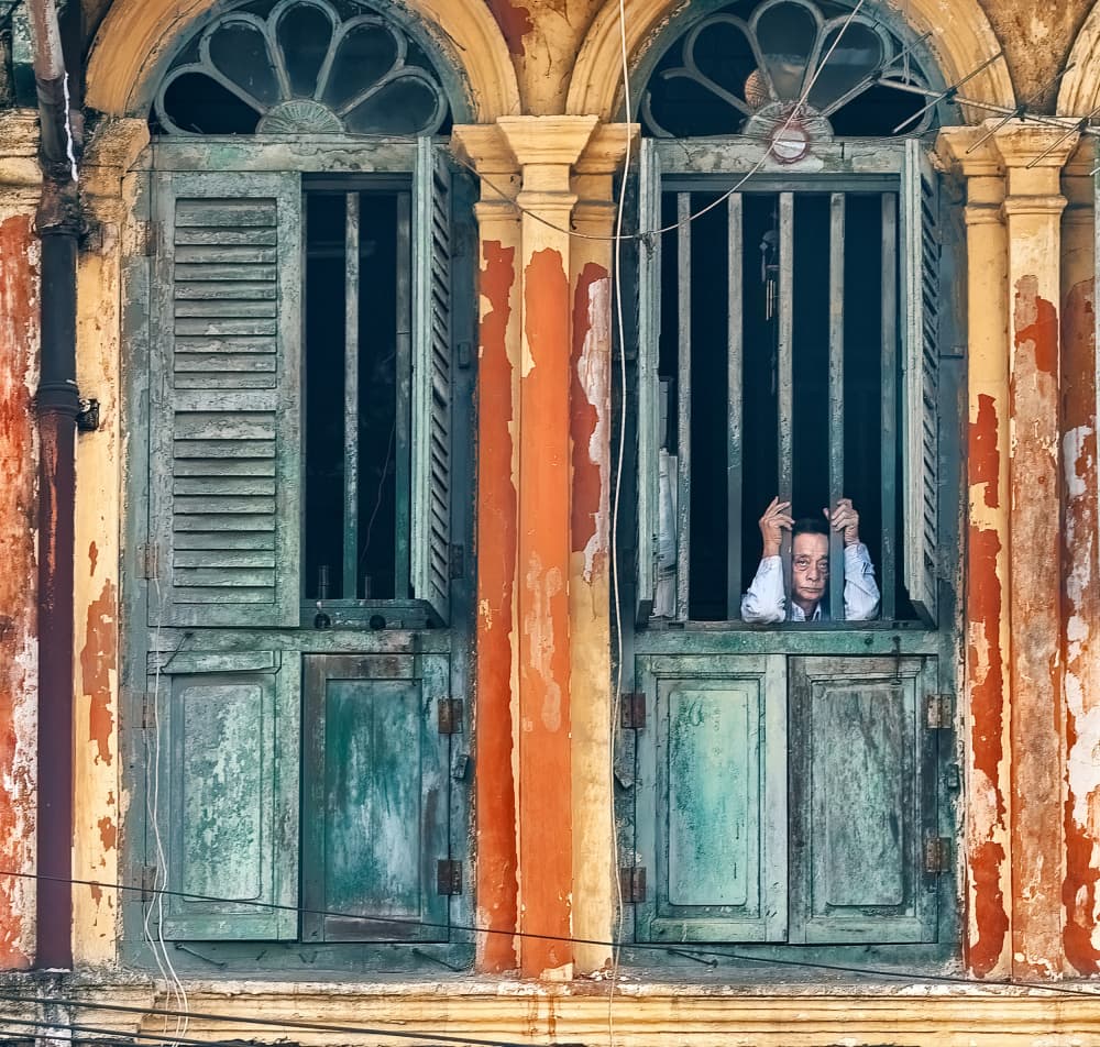 Man Through Window Bars by Wayne Pearson — canvas wall art