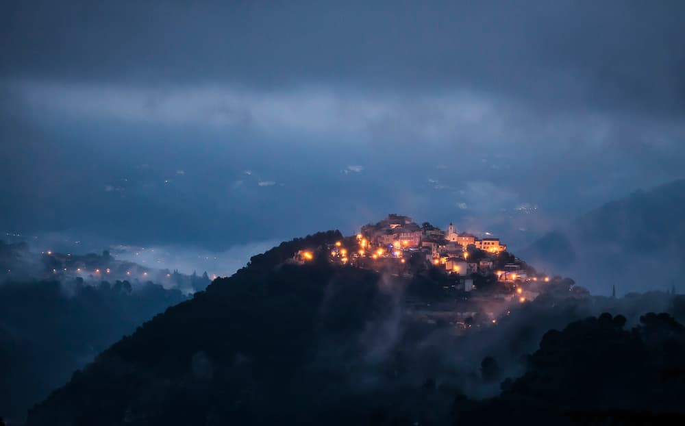 Misty Hillside Village Lights by Art Lionse — canvas wall art