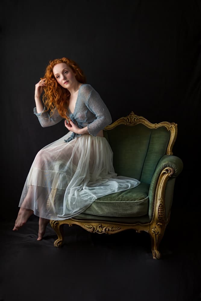 Elegant Redhead on Vintage Chair by Q Liu — canvas wall art