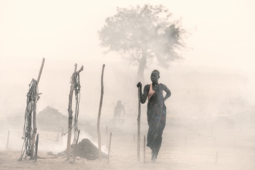 African Woman Smoky Landscape by Trevor Cole — canvas wall art