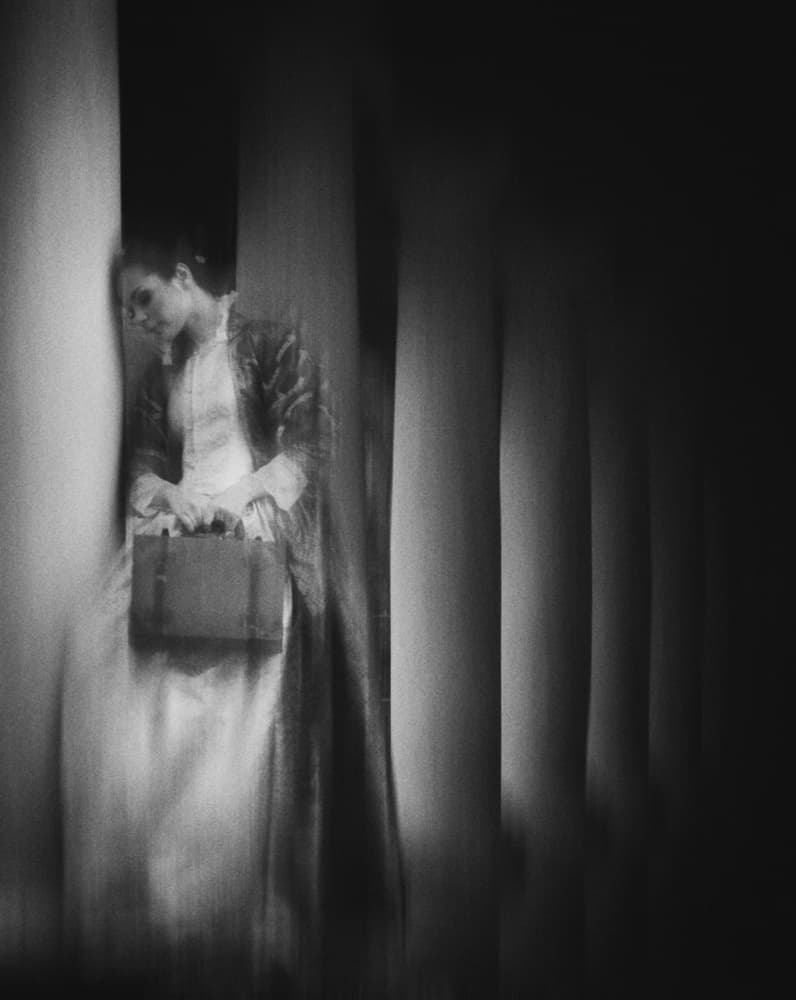 Pensive Woman With Case by Kahar Lagaa — canvas wall art