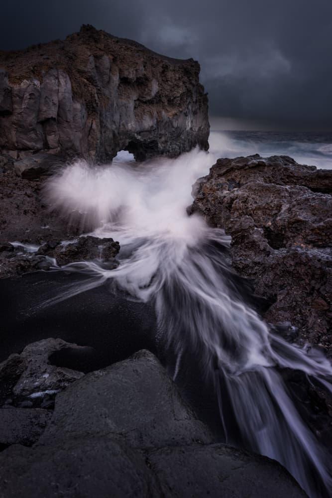Dark Coastal Arch Waves by carmenvillar — canvas wall art