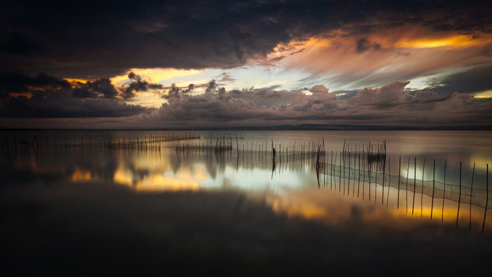 Dramatic Lake Sunset by Gustavo Ribes — canvas wall art