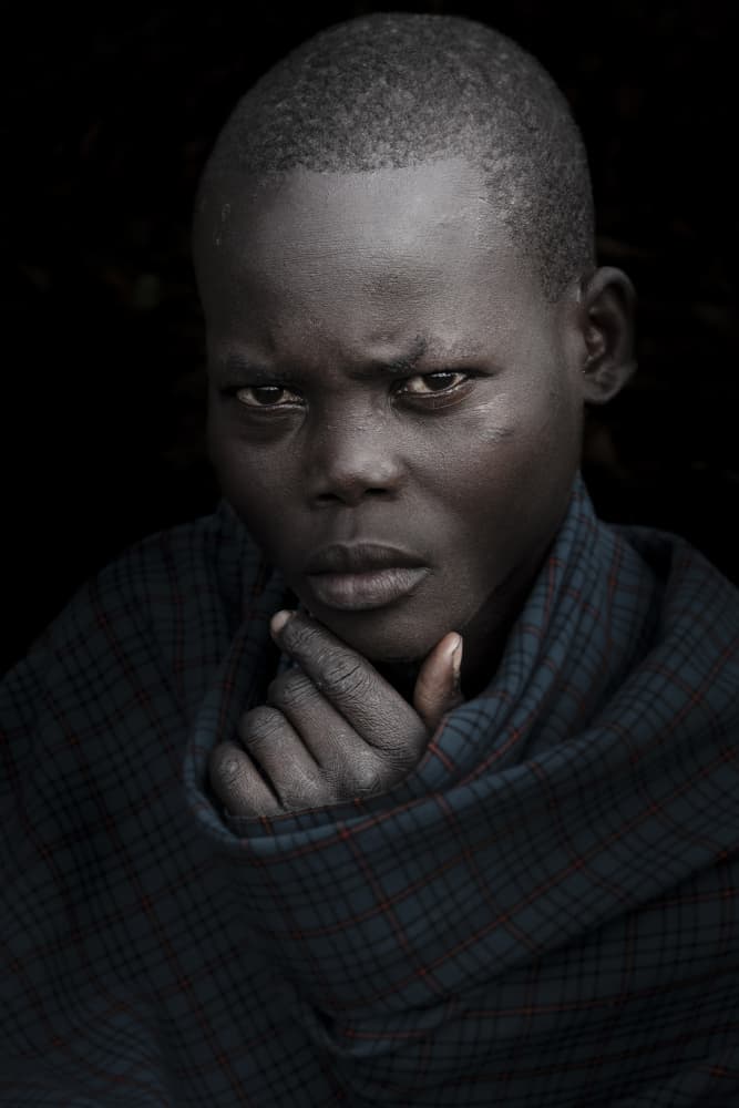 Contemplative Young Boy by Elena Molina — canvas wall art