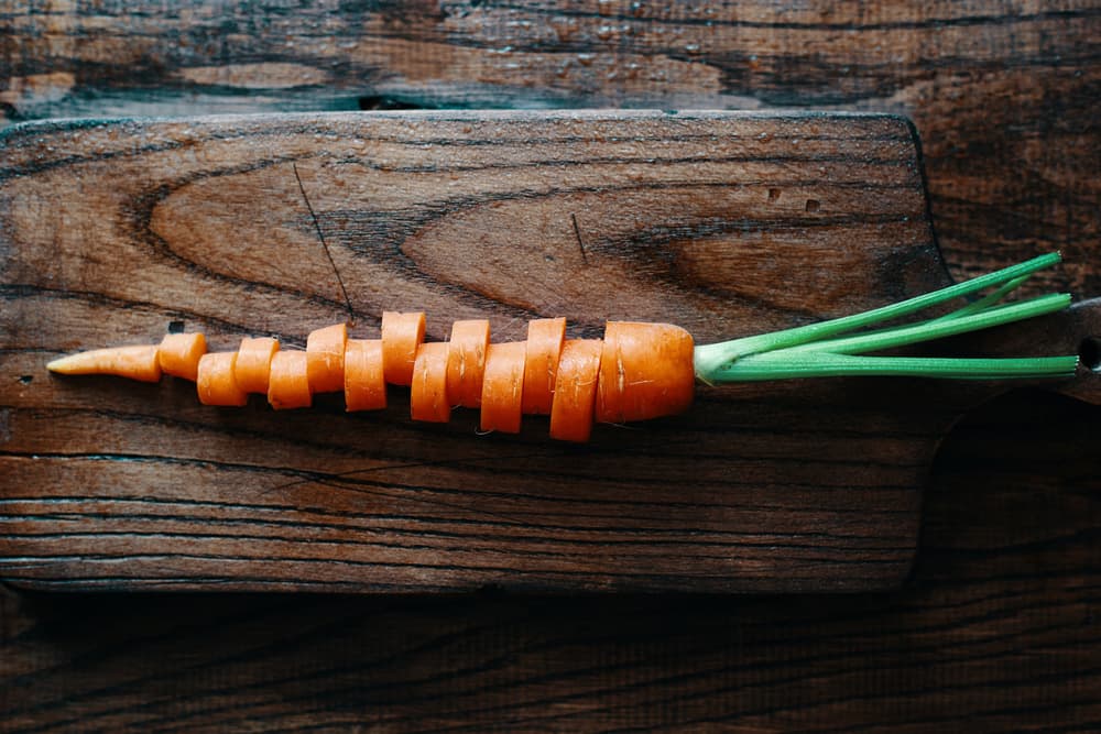 Carrot Slices on Wood by Karina Aleksandrova — canvas wall art