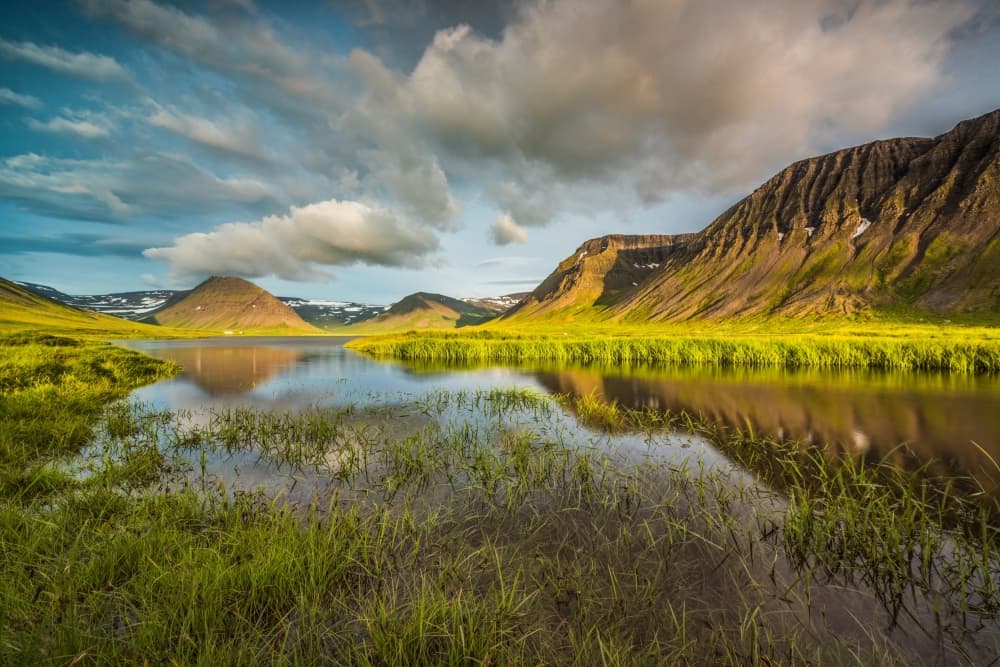 Sunlit Mountain Lake Reflection by Raymond Hoffmann — canvas wall art