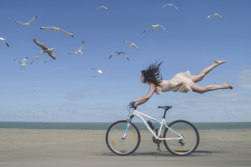 Flying Woman Beach Bike by Karim Aboukelela — canvas wall art