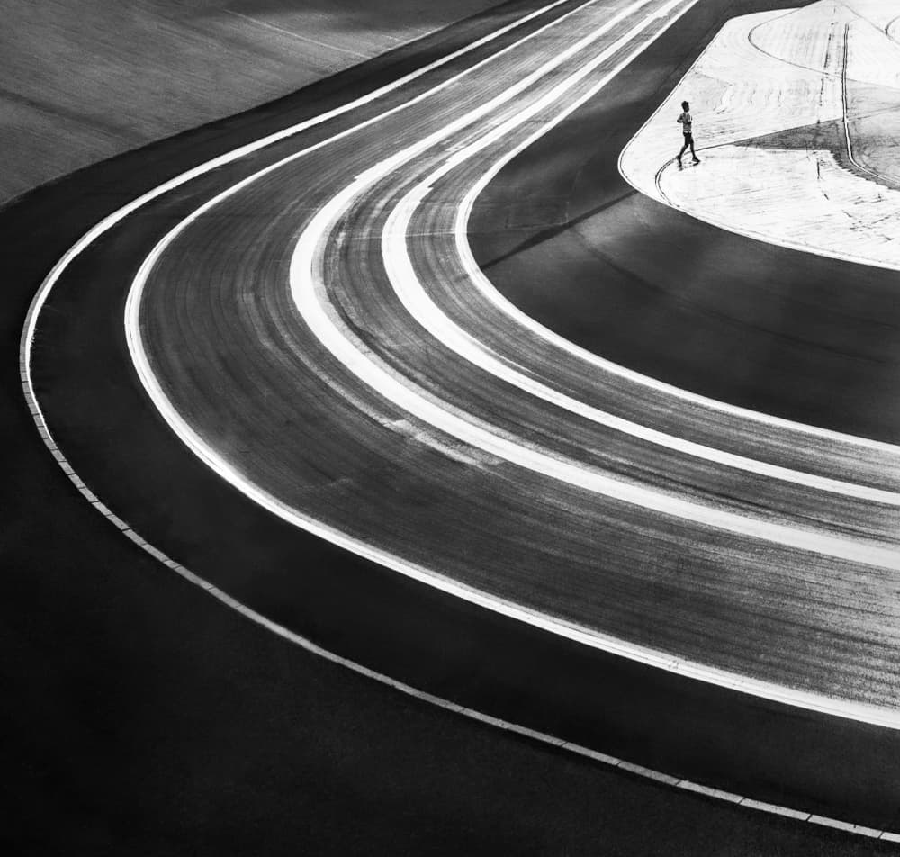 Lone Runner On Track by Sebastian Prioteasa — canvas wall art