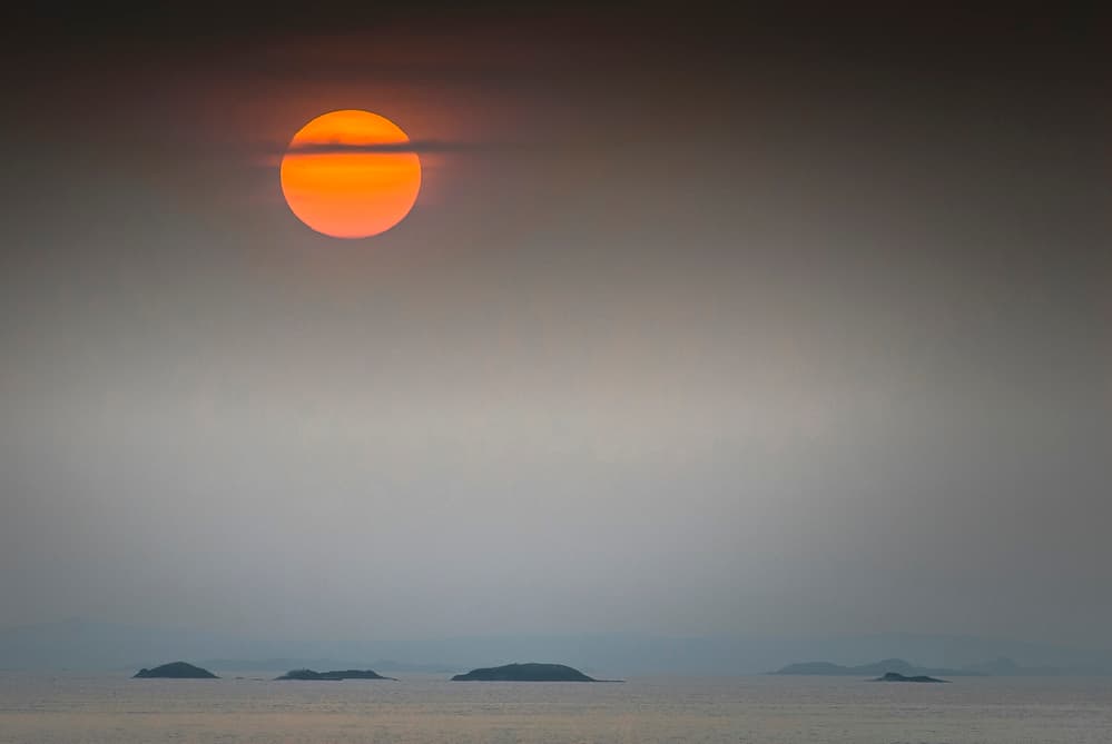 Orange Sun Over Islands by Benny Pettersson — canvas wall art