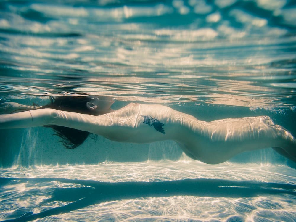 Floating Woman Underwater by Mel Brackstone — canvas wall art