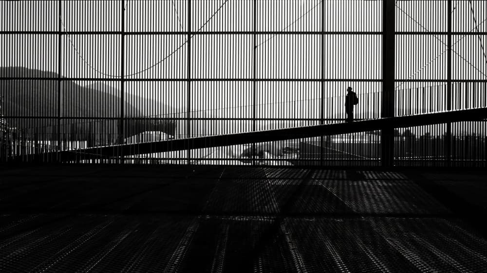 Lone Figure on Bridge by Wanjae Choi — canvas wall art