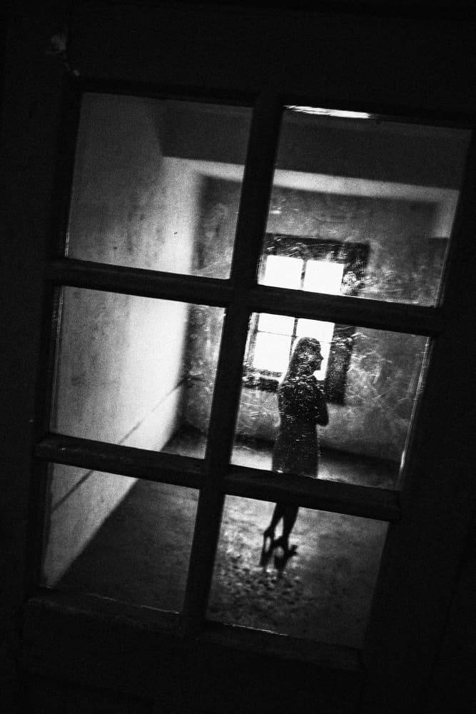 Solitary Woman Through Window by Parole Kim — canvas wall art