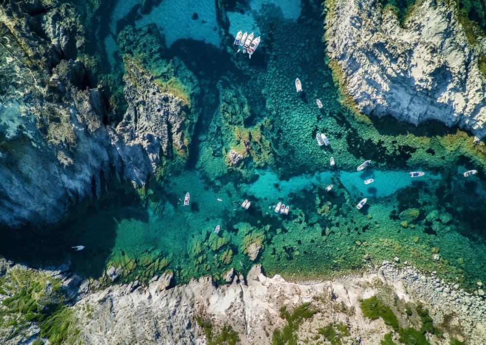 Turquoise Cove Boats by Daniele Atzori — canvas wall art