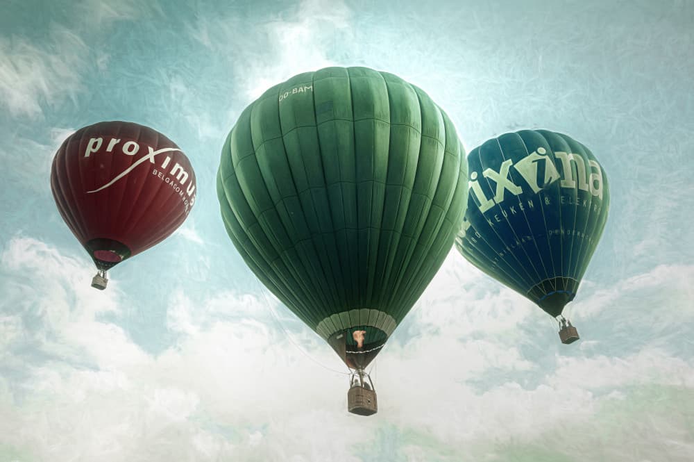 Soaring Hot Air Balloons by Marc Huybrighs — canvas wall art